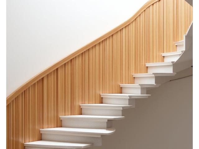 Modern staircase with bamboo railing design, blending safety and natural aesthetics.