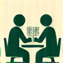 Stylized icon of two people discussing design plans at a table, representing an in-depth consultation. Incorporates brand colors.